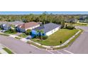 Beautiful corner-lot home featuring a well-manicured lawn and tropical landscaping at 4706 Roycroft Ter, Parrish, FL 34219