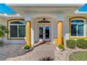 Inviting front entrance showcasing double doors framed by decorative pillars and well-maintained landscaping at 5872 Mckinley Rd, Venice, FL 34293