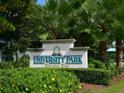 Signage for the University Park Country Club shows the beautiful landscaping in the area at 6316 Walton Heath Pl, University Park, FL 34201