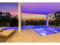 Inviting outdoor pool and spa area with stylish lounge chairs and scenic views at 7003 Holmes Blvd, Holmes Beach, FL 34217