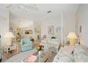 Bright living room featuring neutral colors, comfortable furnishings, and a view of the dining area at 7407 29Th Avenue W Dr # 2288, Bradenton, FL 34209