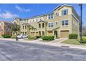 Attractive townhome exteriors featuring neutral colors, garages, and well-maintained landscaping at 9006 White Sage Loop # 3606, Lakewood Ranch, FL 34202