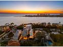 Aerial view of luxury coastal homes near the ocean, perfect for serene waterfront living at 116 Garden Ln, Sarasota, FL 34242