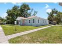 Charming single-story home on a manicured lawn showcases classic design and serene neighborhood setting at 1301 12Th S St, St Petersburg, FL 33705