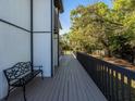 The porch has a bench and a long view at 1471 Arcadia Ave, Sarasota, FL 34232