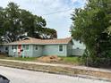Street view of the one-story home with its beautiful green grass and nice trees at 1739 16Th S Ave, St Petersburg, FL 33712
