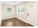 Bright living room featuring hardwood floors, neutral walls, and abundant natural light through windows at 1739 16Th S Ave, St Petersburg, FL 33712