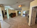 Bright and airy living room featuring tile and carpet flooring, with a neutral color palette at 2874 56Th Avenue E Cir, Bradenton, FL 34203