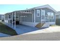 Cozy single-Gathering home with a convenient carport, manicured lawn, and a charming facade at 3333 26Th E Ave # 1220, Bradenton, FL 34208