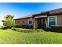 Attractive home featuring a well-kept lawn and decorative shrubs enhancing the property's entrance at 4617 Alexandria Ct, Palmetto, FL 34221