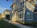 Beautiful blue townhome featuring well-maintained landscaping at 5560 Rosehill Rd # 105, Sarasota, FL 34233
