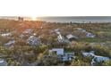 Panoramic aerial shot showcasing the home's location near the coastline, a beautiful view and lush surroundings at 603 Tremont St, Sarasota, FL 34242