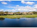 Scenic view of the community pond from the home's backyard at 7052 Woodmore Ter, Lakewood Ranch, FL 34202