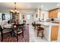 Open-concept kitchen featuring granite countertops, stainless steel appliances, and a breakfast bar at 916 W Faith Cir, Bradenton, FL 34212