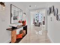 Bright hallway with marble floors, modern decor, and views into the dining area at 1350 Main St # 1701, Sarasota, FL 34236