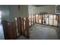 Kitchen being remodeled with exposed framing and white cabinets at 1801 Gulf N Dr # 184, Bradenton Beach, FL 34217