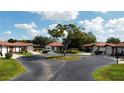 Aerial view of a residential street showcases neat landscaping, sidewalks and well maintained exteriors at 3002 Vivienda Dr # 22, Bradenton, FL 34207