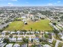 Scenic aerial view of a neighborhood featuring a cozy home encircled near schools and lush green spaces at 3016 Taunton W Dr, Bradenton, FL 34205