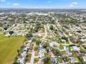 Panoramic aerial view of a residential neighborhood with a charming home with a pool encircled at 3016 Taunton W Dr, Bradenton, FL 34205