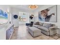 Open concept living room design with modern furnishings, stylish decor, and neutral color palette at 3701 54Th W Dr # 103, Bradenton, FL 34210