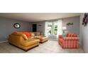 Cozy living room with tile floors, neutral walls and comfortable furnishings at 5859 Lincoln Rd, Venice, FL 34293