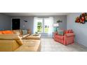 Inviting living room featuring neutral walls, tile floors, and lots of natural light at 5859 Lincoln Rd, Venice, FL 34293