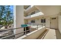 Condo complex featuring multiple units, balconies, covered entry, and secure access at 8735 Midnight Pass Rd # 105B, Sarasota, FL 34242