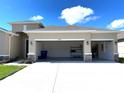 Spacious three-car garage featuring ample storage and organization options at 13393 Golden Lime Ave, Spring Hill, FL 34609