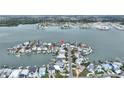 Aerial view of waterfront community, showcasing the surrounding water and neighborhood at 16103 6Th E St, Redington Beach, FL 33708