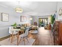 Bright living room featuring hardwood floors, a comfortable couch, and access to an outdoor patio at 2526 Clubhouse Dr # 203, Sarasota, FL 34232