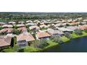 Scenic aerial view of a residential community with waterfront homes and lush landscaping at 2879 Grazeland Dr, Sarasota, FL 34240