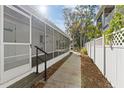 Inviting screened-in back porch, ideal for relaxing and enjoying the outdoors at 6201 Waverly Rd, Weeki Wachee, FL 34607
