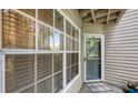 Inviting entrance with a 'Welcome' mat, windows, and a door with the number 307 at 850 S Tamiami Trl # 307, Sarasota, FL 34236