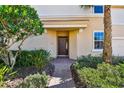 A charming entryway featuring a brick path and manicured landscaping leading to the front door at 9441 Discovery Ter # 101A, Bradenton, FL 34212
