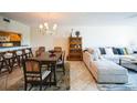 Open-concept living and dining area with a breakfast bar and stylish decor at 1000 Riverside Dr # B102, Palmetto, FL 34221