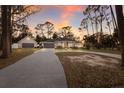 Well-maintained home boasts a curved driveway with a three-car garage and extra storage at 13608 11Th E Ter, Bradenton, FL 34212