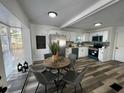 Charming kitchen with stainless steel appliances and a breakfast nook by a bright window at 1397 43Rd St, Sarasota, FL 34234