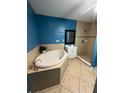 Bathroom featuring a standalone tub, walk-in shower, and tiled flooring at 1807 48Th W Ave, Bradenton, FL 34207