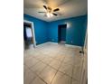 Bedroom showcasing tile floors, and neutral walls at 1807 48Th W Ave, Bradenton, FL 34207