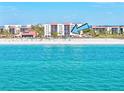 Stunning beachfront condo view, showing the sandy beach, and the turquoise waters of the ocean at 1945 Gulf Of Mexico Dr # M2-110, Longboat Key, FL 34228