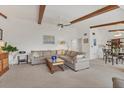 Comfortable living area with a ceiling fan, sofa, and a combined living and dining space at 2446 Clubhouse Cir # 202, Sarasota, FL 34232