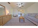 Inviting living room with a ceiling fan and a cozy seating area featuring a comfortable sofa at 4015 11Th W Ave, Bradenton, FL 34205