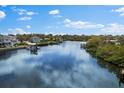 Serene waterfront scenery showcasing calm waters and private boat docks for peaceful living and recreation at 503 1St Nw Ave, Ruskin, FL 33570