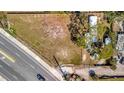 Aerial view of cleared lot ready for your dream home with mature trees and fencing at 5061 Placida Rd # A, Englewood, FL 34224