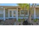 Charming home facade with well-manicured landscaping and a welcoming brick walkway at 618 Buttonwood Dr, Longboat Key, FL 34228