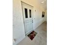 Front door of unit 72 with a decorative door and fall-themed welcome mat at 6300 Flotilla Dr # 72, Holmes Beach, FL 34217