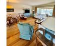 Cozy living room with hardwood floors and sliding glass door access to the lanai at 6300 Flotilla Dr # 72, Holmes Beach, FL 34217