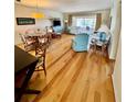 Bright living room with wood floors, comfortable seating, and natural light at 6300 Flotilla Dr # 72, Holmes Beach, FL 34217