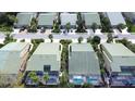 Community aerial view featuring lush greenery, pools, green roofs and orderly street layout at 8536 54Th Avenue E Cir, Bradenton, FL 34211