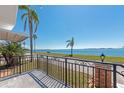 Enjoy waterfront views from this home's balcony, complete with black metal railing at 10315 Cortez W Rd # 38Bv, Bradenton, FL 34210